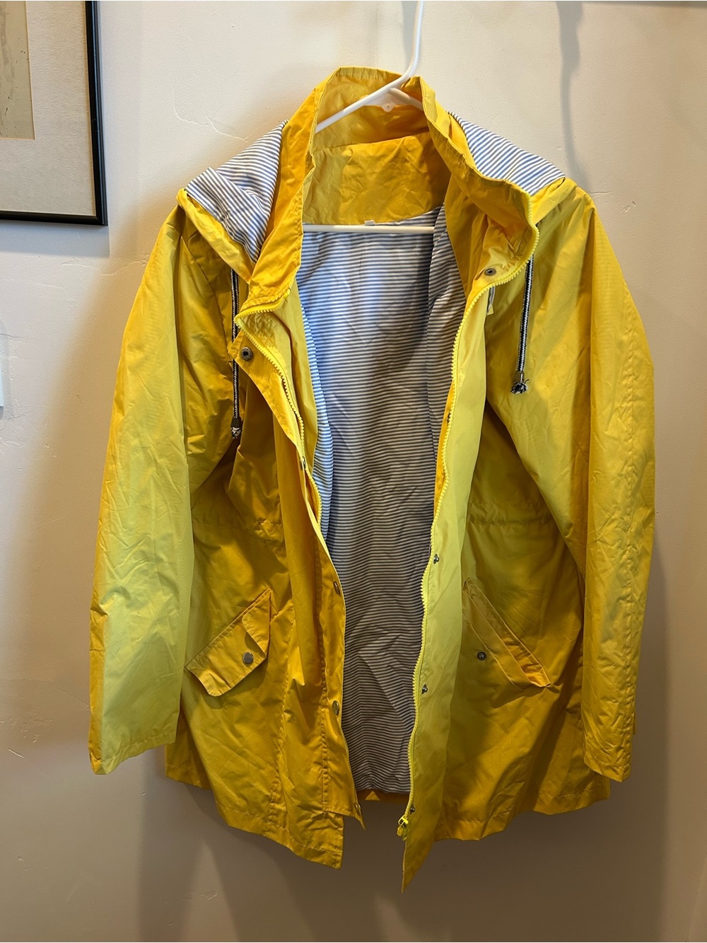 Women’s rain jacket with attached hood.
